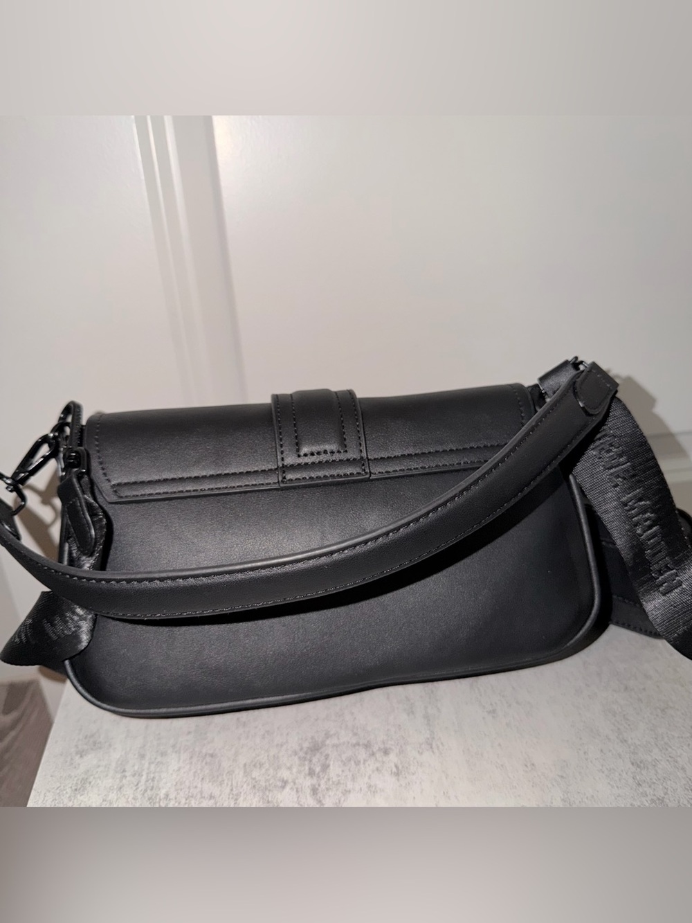 Black Steve Madden Bcharle crossbody bag with a prominent buckled strap detail - Picture 3 of 4